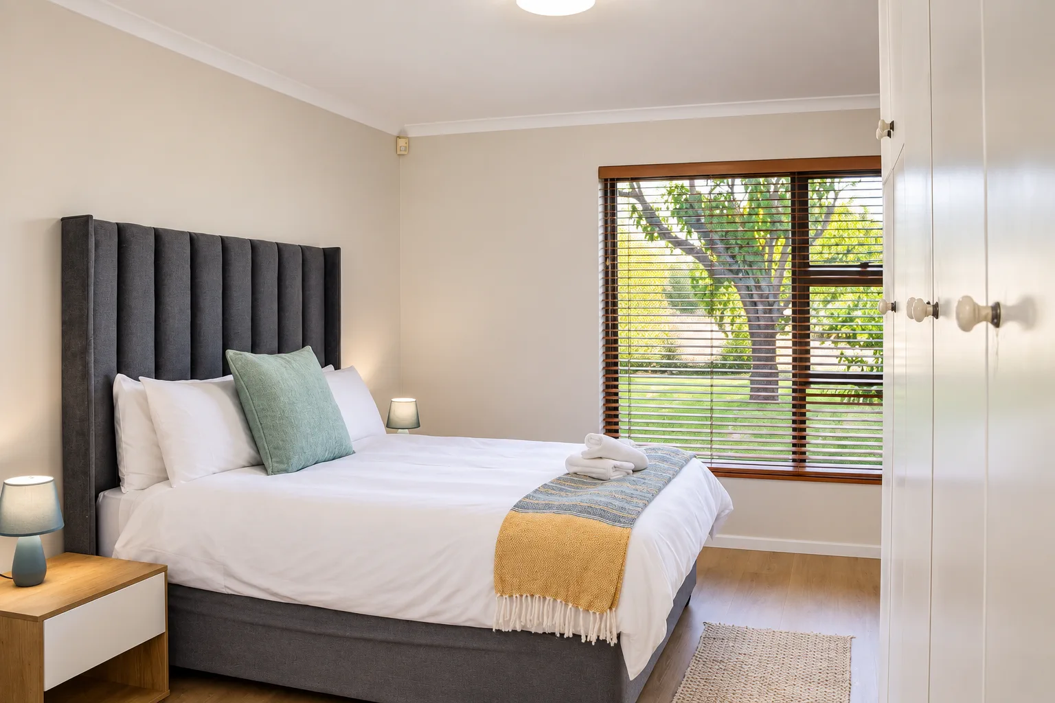 Family Apartment, Bedroom 1, queen bed with tree view