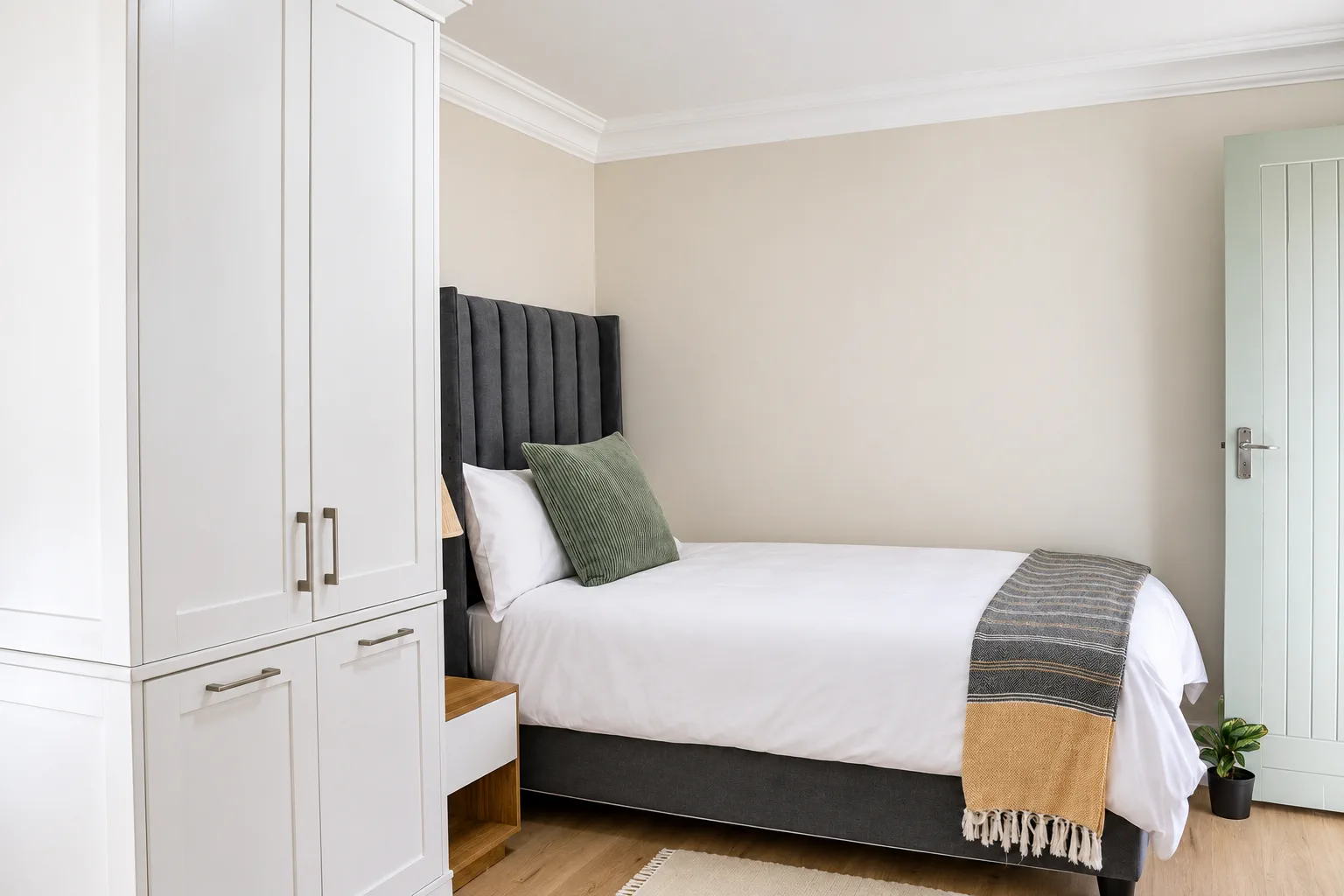 Family Apartment, Bedroom 2, single bed and white wardrobe